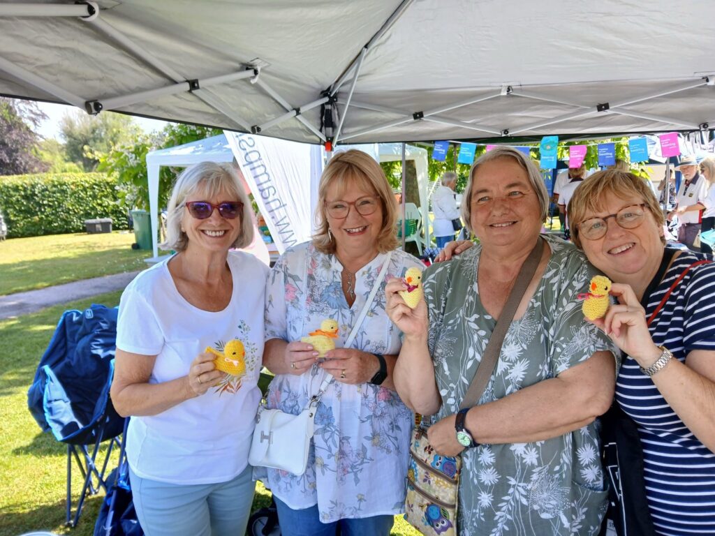 Abbotswood Romsey WI at The Mayor's Picnic July 2025 with knitted ducks